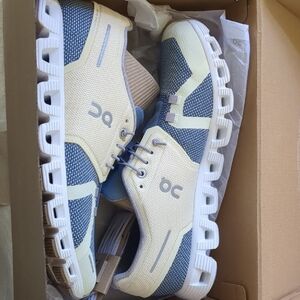 On Running Light Yellow and Blue Athletic Shoes